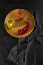 fresh and delicious, yellow, red and orange peppers on black background Royalty Free Stock Photo