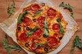 Fresh delisious pepperoni pizza on the wooden table, top view