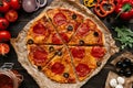 Fresh delisious pizza with pizza ingredients on the wooden table, top view Royalty Free Stock Photo