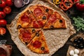 Fresh delisious pizza with pizza ingredients on the wooden table, top view Royalty Free Stock Photo