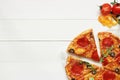 Fresh delisious sliced pizza on the wooden table with copy space, top view Royalty Free Stock Photo