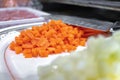 Fresh Diced Raw Carrots being Prepared