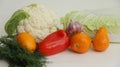 Fresh different vegetables yellow tomatoes, peppers, cauliflower, dill, garlic on a white background Royalty Free Stock Photo