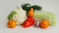 Fresh different vegetables yellow tomatoes, peppers, cauliflower, dill, garlic on a white background Royalty Free Stock Photo