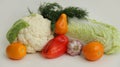 Fresh different vegetables yellow tomatoes, peppers, cauliflower, dill, garlic on a white background Royalty Free Stock Photo