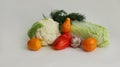 Fresh different vegetables yellow tomatoes, peppers, cauliflower, dill, garlic on a white background Royalty Free Stock Photo