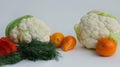 Fresh different vegetables yellow tomatoes, peppers, cauliflower, dill on a white background Royalty Free Stock Photo