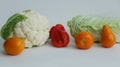 Fresh different vegetables yellow tomatoes, peppers, cauliflower, dill on a white background Royalty Free Stock Photo