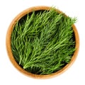 Fresh dill fronds in wooden bowl, also dill weed