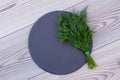 Fresh dill and slate on wooden background. Royalty Free Stock Photo