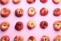 Fresh donut peaches on light pink background, flat lay Royalty Free Stock Photo