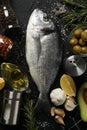 Fresh Dorado fish and cooking ingredients on background, top view Royalty Free Stock Photo