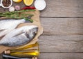 Fresh dorado fish cooking with spices and condiments