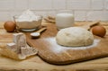 Fresh dough on the board and fresh yeast Royalty Free Stock Photo