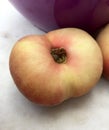 Fresh doughnut peach fruit in closeup