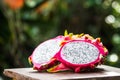 Fresh Dragon fruit on wooden bokeh background