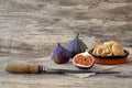 Fresh and dried figs on wood