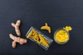 Fresh and dried turmeric roots and powder on black background. Top view, copy space Royalty Free Stock Photo