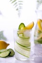 Fresh drink with cucumber, lemon and rosemary herb. Cold summer lemonade. On white background Royalty Free Stock Photo