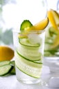 Fresh drink with cucumber, lemon and rosemary herb. Cold summer lemonade. On white background Royalty Free Stock Photo