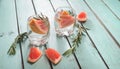 Fresh drink with grapefruit and rosemary on blue green shabby ch