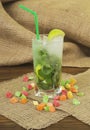 Fresh drink lemonade mojito in a glass on wooden background. Royalty Free Stock Photo