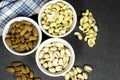 fresh dry nuts almonds, pistachio, cashews in bowls.