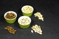 nuts (almonds, pistachio, cashews) in bowls