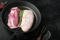 Fresh duck meat for food, Raw duck breast, on frying cast iron pan, on black stone background Royalty Free Stock Photo