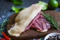 Fresh duck meat for food, Raw duck breast with herb spices ready to cook on wooden cutting board Royalty Free Stock Photo