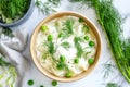 Fresh dumplings with sour cream, green peas, and dill on marble surface Royalty Free Stock Photo