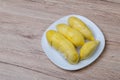 Fresh durian fruit placed on a white plate. Durian the king of fruits The yellow color is on the white plate. Ripe durian tropical Royalty Free Stock Photo