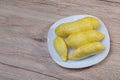 Fresh durian fruit placed on a white plate. Durian the king of fruits The yellow color is on the white plate. Ripe durian tropical Royalty Free Stock Photo