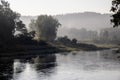 Fresh early morning mist in the forest near the river. Royalty Free Stock Photo