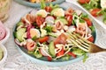 Fresh Easter salad with prosciutto ham quail eggs and vegetables Royalty Free Stock Photo