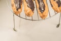 Fresh eclairs on a white marble table/fresh eclairs on a white marble teble. Top view