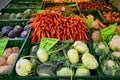 Fresh ecological vegetable stall at farmer\'s market in Germany, turnip, cauliflowers, carrots, cabbages, organic food