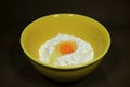 Fresh egg on raw flour in yellow ceramic mixing bowl Royalty Free Stock Photo