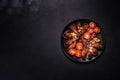 Fresh eggplant baked with minced meat, spices and herbs on a black plate Royalty Free Stock Photo