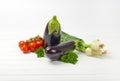 Fresh eggplants, tomatoes and spring onion Royalty Free Stock Photo