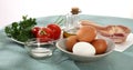 fresh eggs, bacon, vegetables and oil. ingredients for making scrambled eggs. Royalty Free Stock Photo