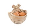 Fresh eggs in a basket made from dried leaf isolated on white background Royalty Free Stock Photo