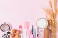 Fresh eggs and cake flour  with kitchen utensils for pastries on pink background Royalty Free Stock Photo