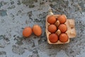 Fresh Eggs in paper brown box on a rustic background Royalty Free Stock Photo