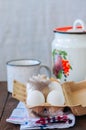 Fresh eggs in a paper container and milk in a can on a wooden ba Royalty Free Stock Photo