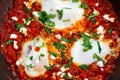 Fresh Eggs poached, tomato sauce and red, yellow pepper, onion Royalty Free Stock Photo