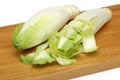 Fresh endive on cutting board Royalty Free Stock Photo