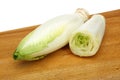 Fresh endive on cutting board Royalty Free Stock Photo