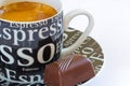 Fresh espresso coffee with crema and praline Royalty Free Stock Photo