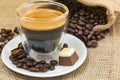 Fresh espresso coffee with crema with pralines